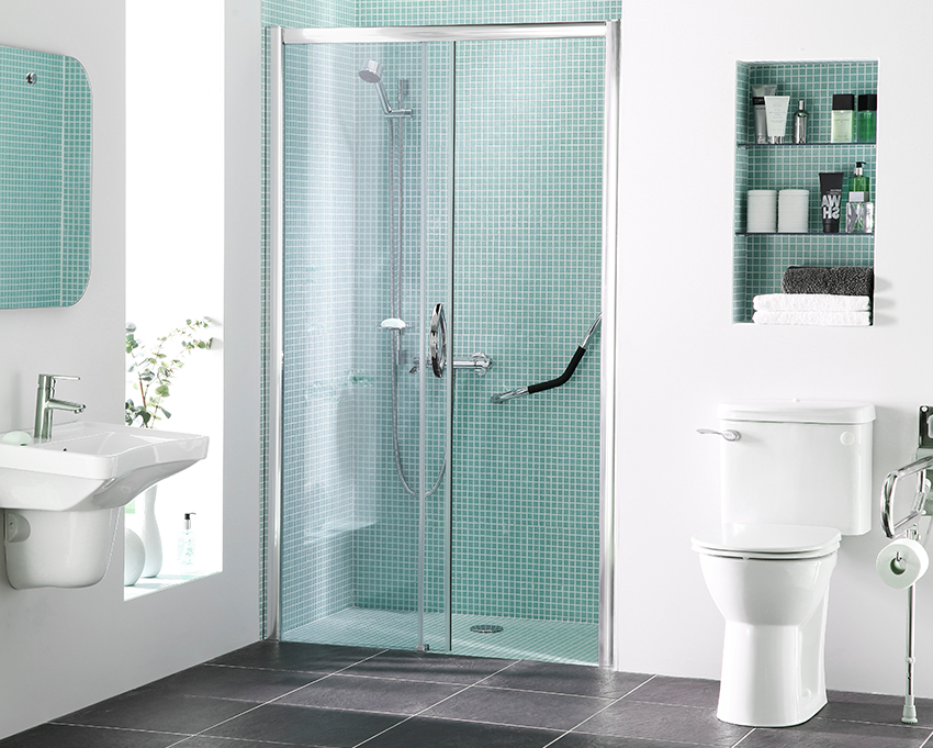 bathroom featuring grab bars and bright colored tile work