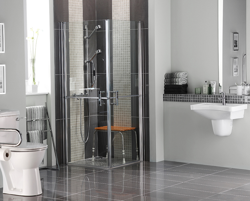 bathroom with walk-in/roll-in shower and comfort height sink and toilet