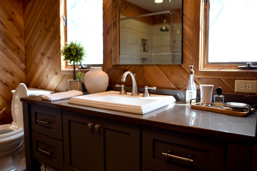 large vanity with sink with dark tones