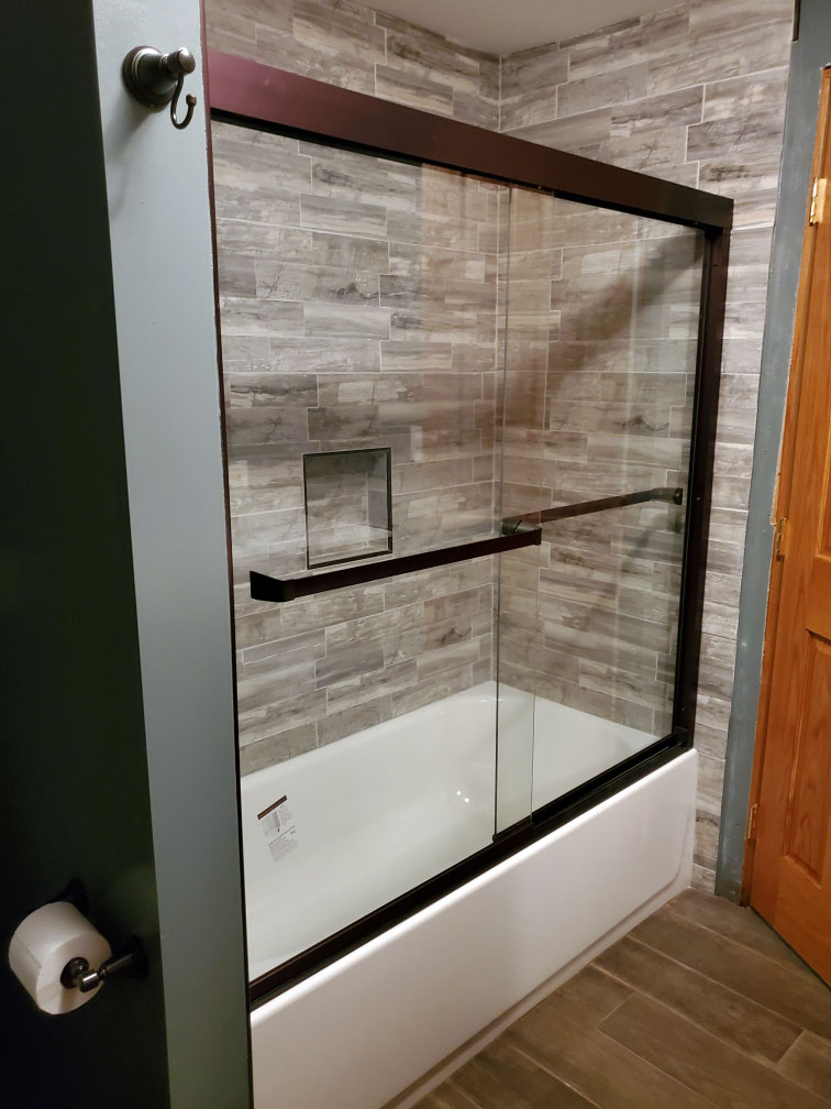 new shower and tub with glass door